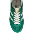 Green and white sneaker with visible branding on a white background