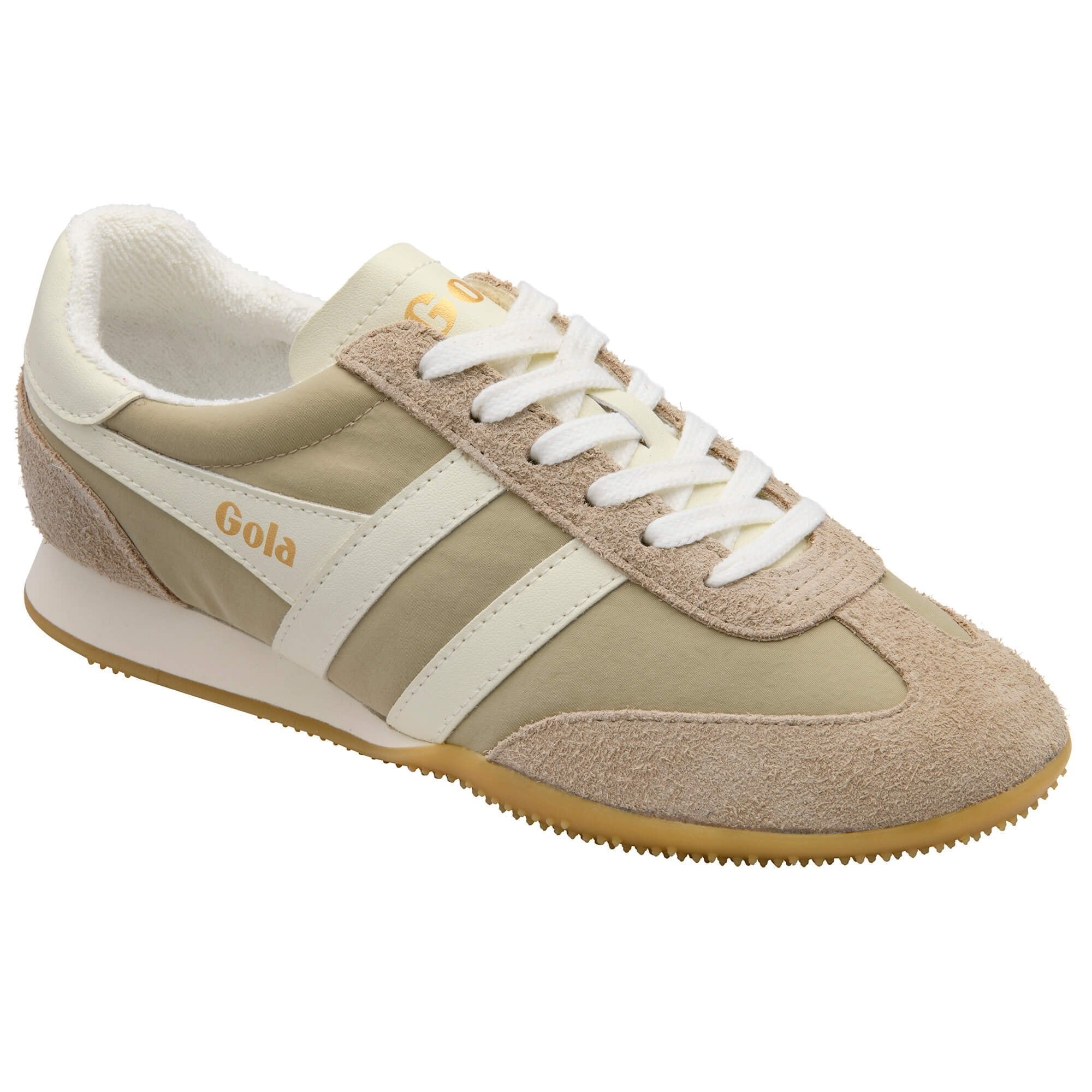 Beige sneaker with white laces and sole on a white background