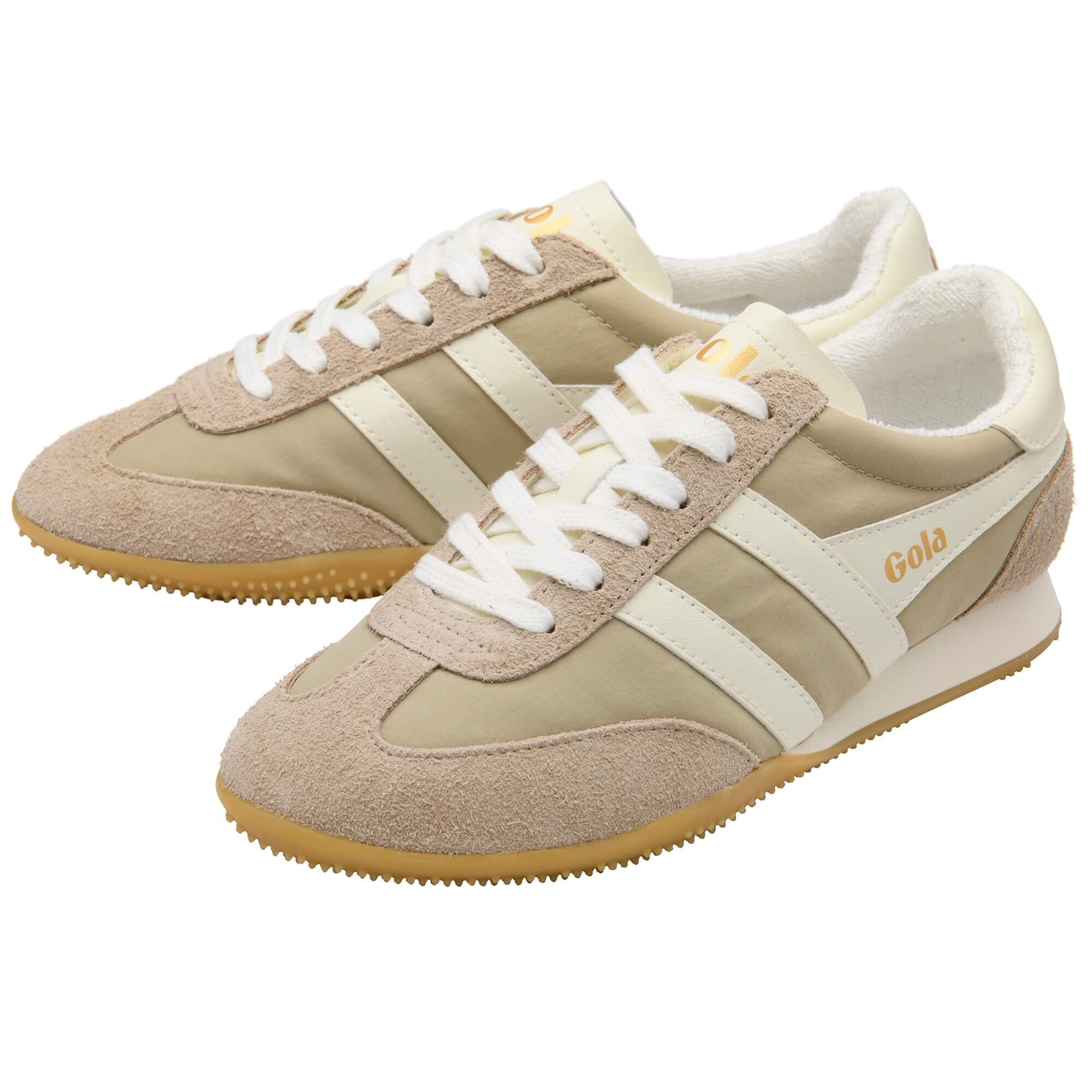 Beige and white sneakers with 'Gola' branding on a white background