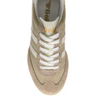 Beige sneaker with white laces on a white background