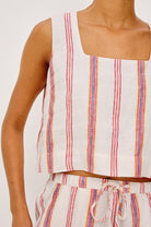 Striped sleeveless top and shorts set on a plain background