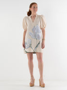 Woman wearing a floral dress on a white background