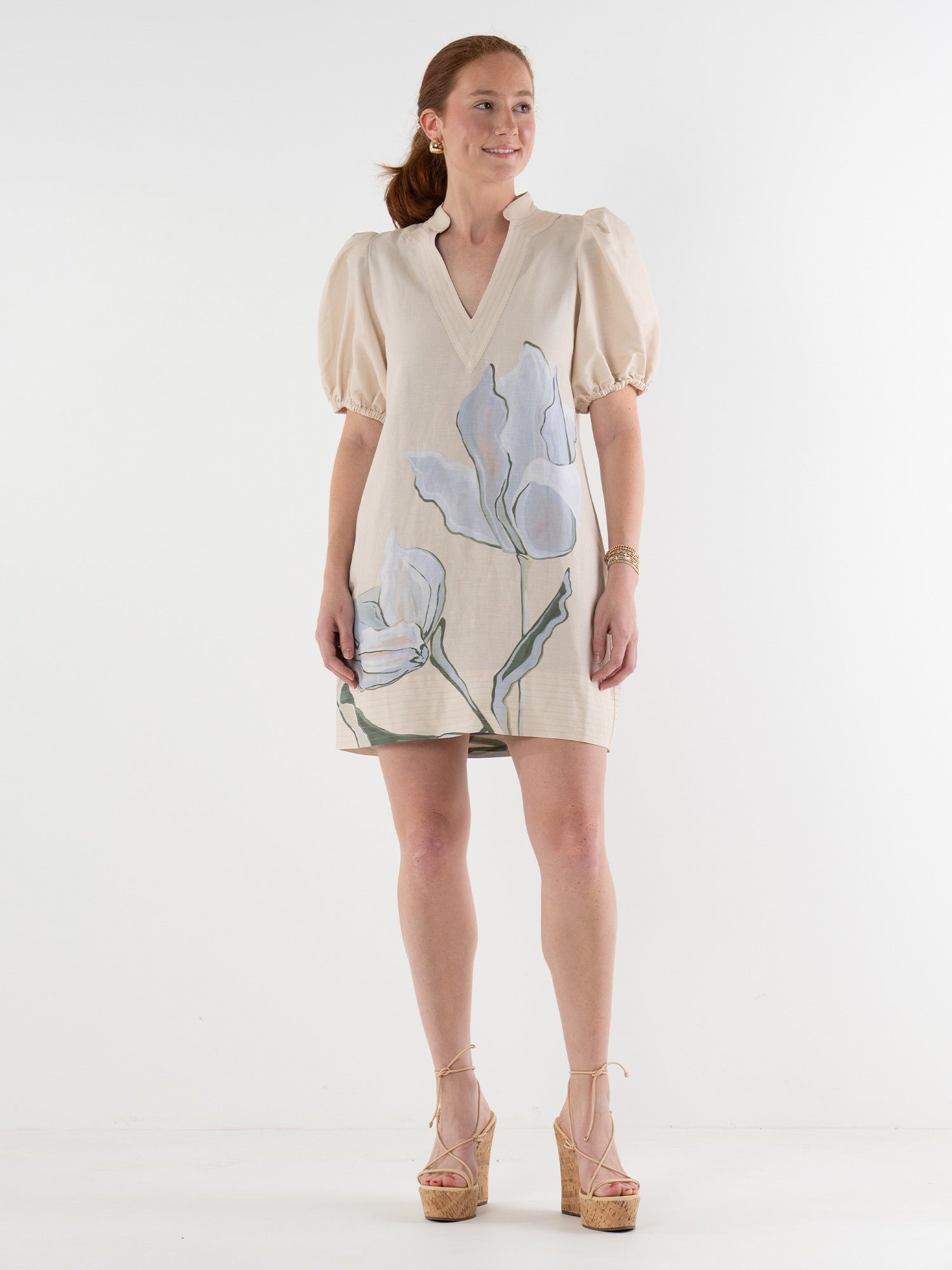 Woman wearing a floral dress on a white background