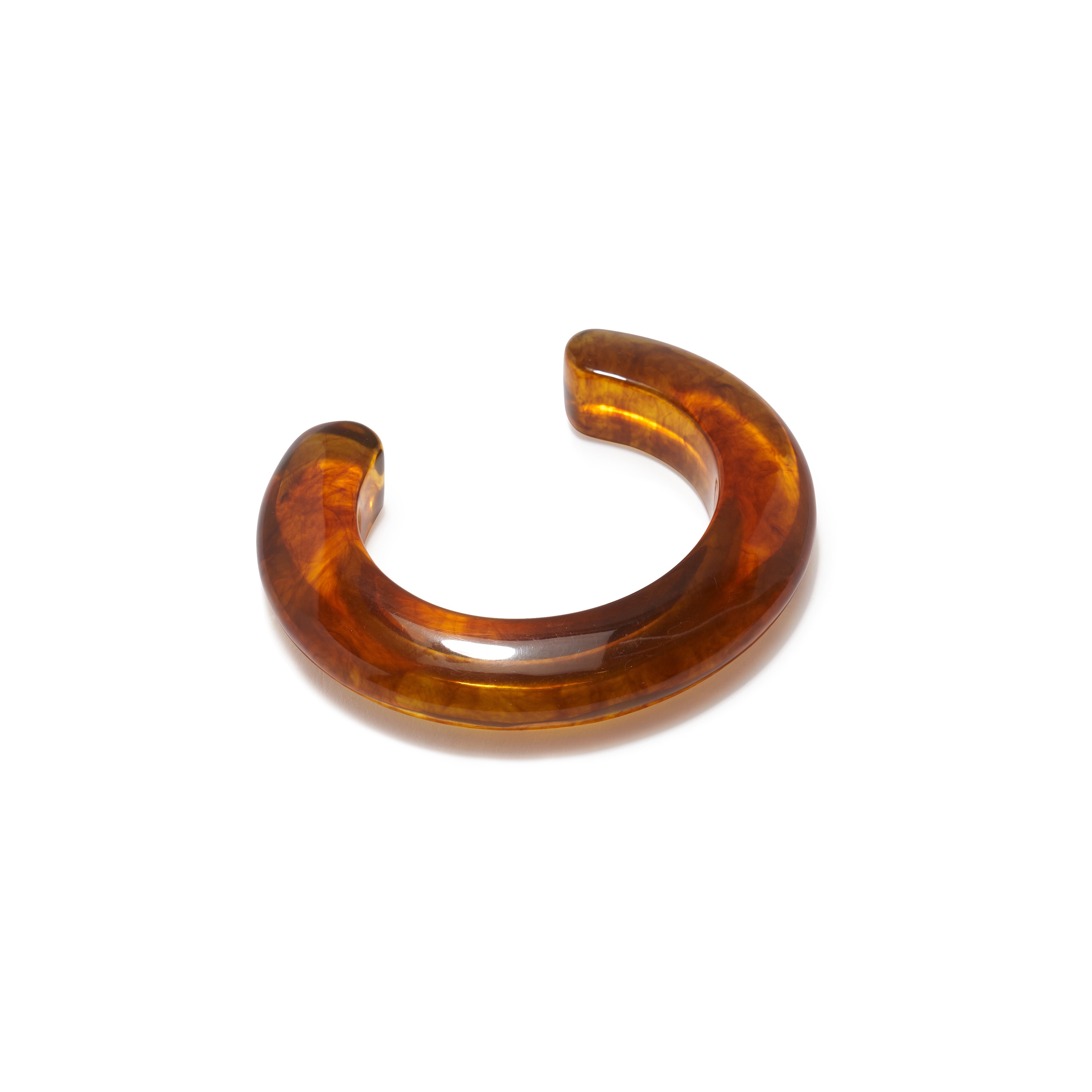 Brown tortoiseshell hair clip on a white background