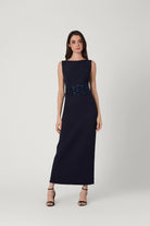 Navy evening gown with beaded waistband on a white background