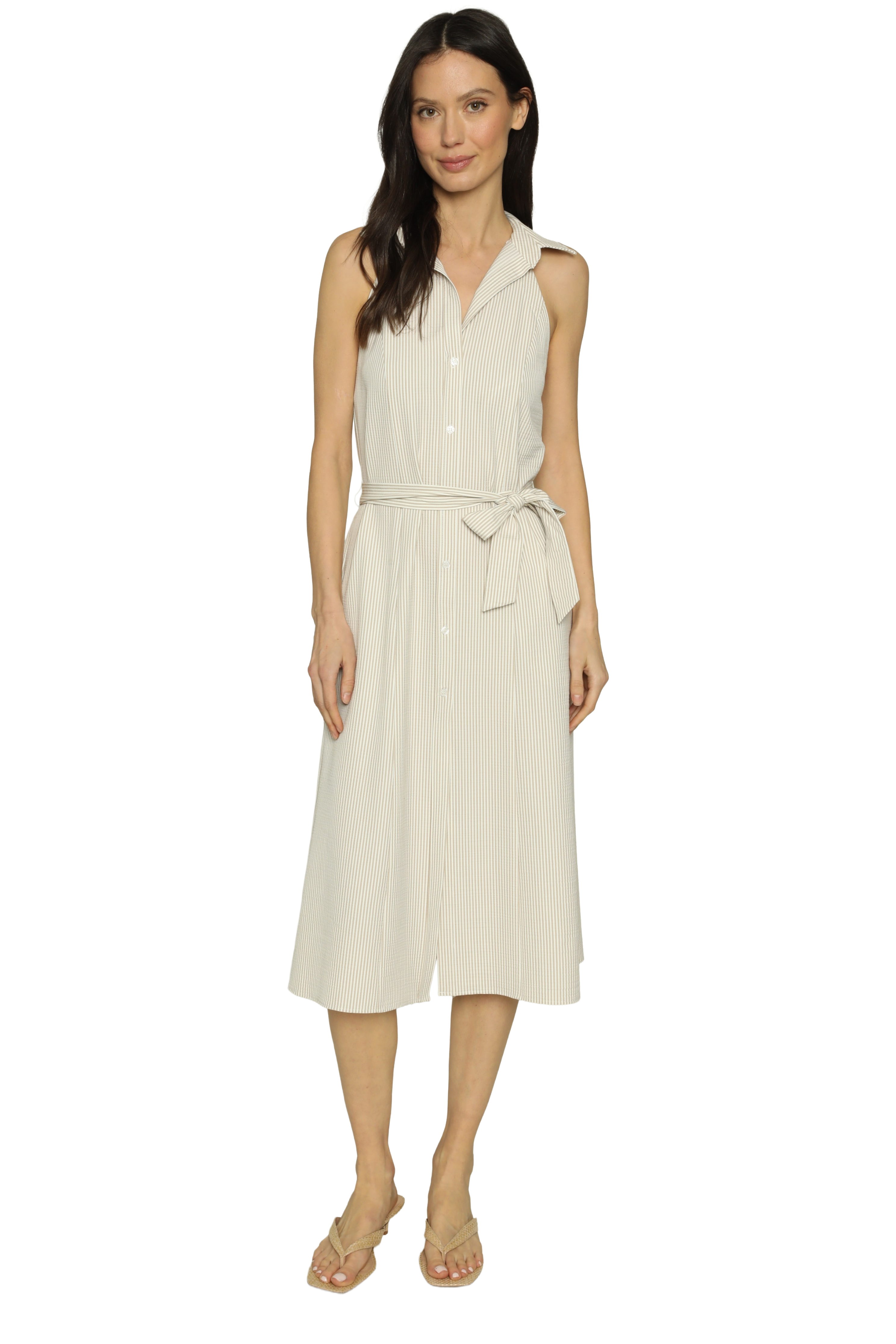 Woman wearing a beige sleeveless dress on a white background