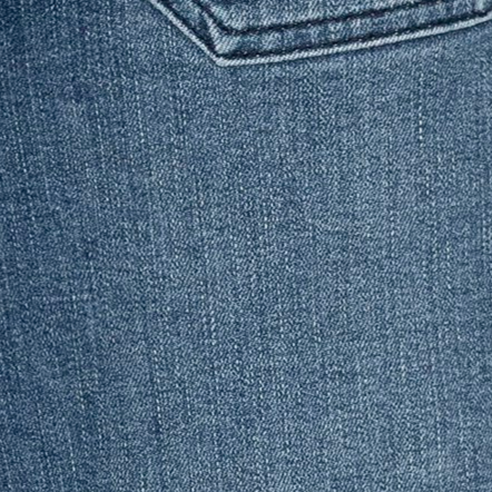 Close-up of blue denim fabric with a pocket