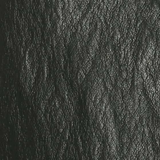A close-up texture shot of black leather with a pebbled grain surface.