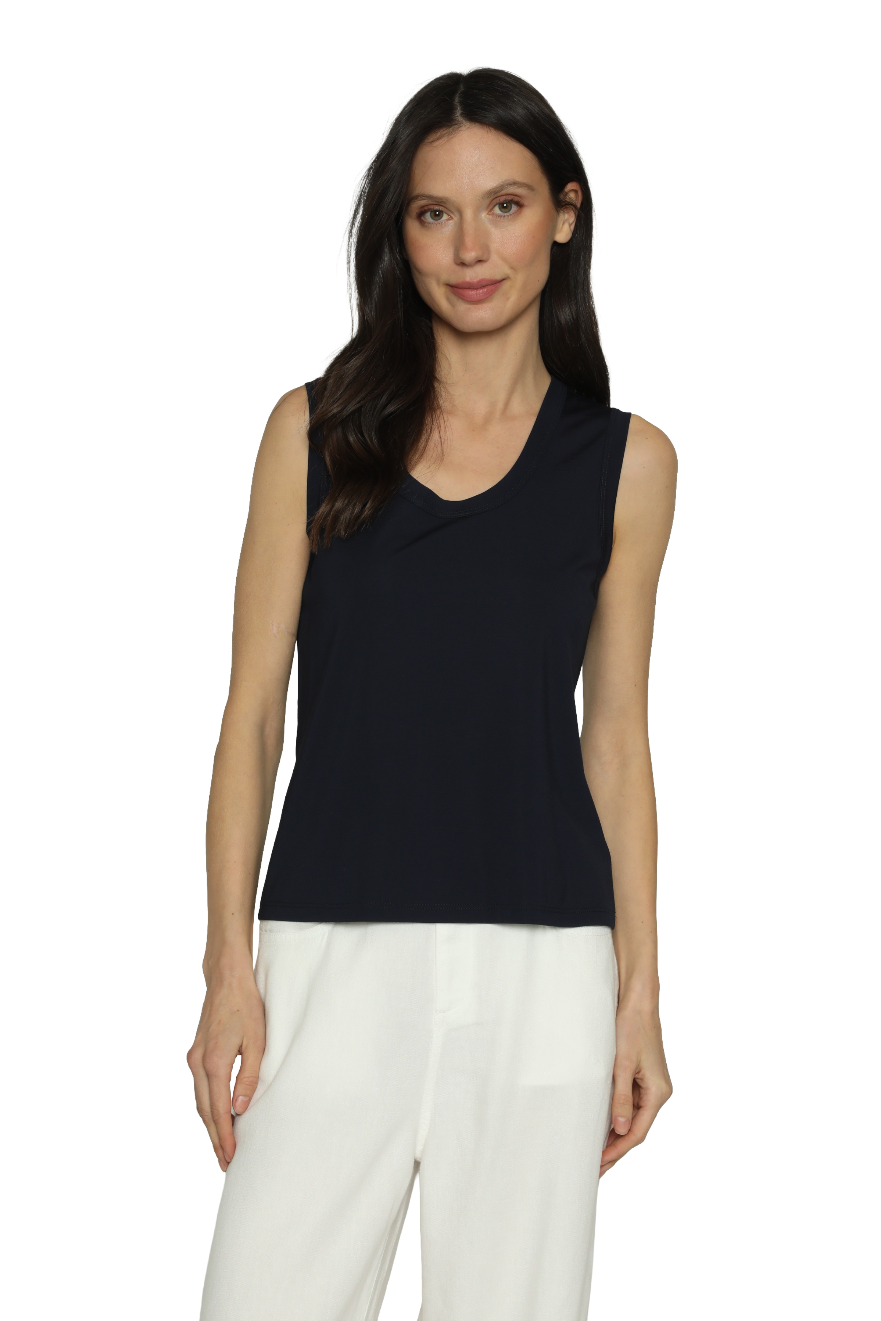 Woman wearing a black sleeveless top and white pants on a white background