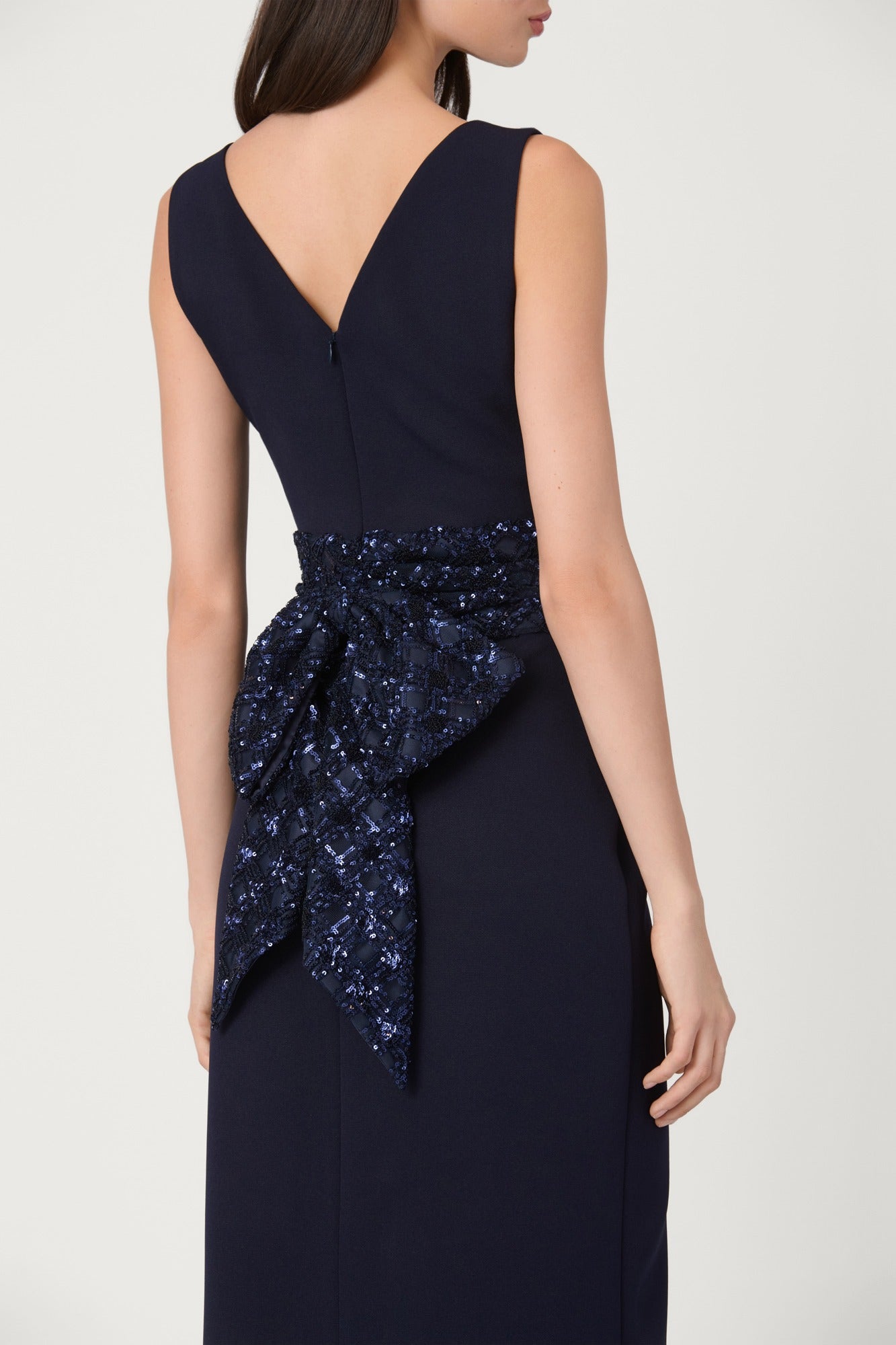 Navy blue dress with sequin detail on a white background