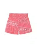 Pink skirt with white patterns on a plain background