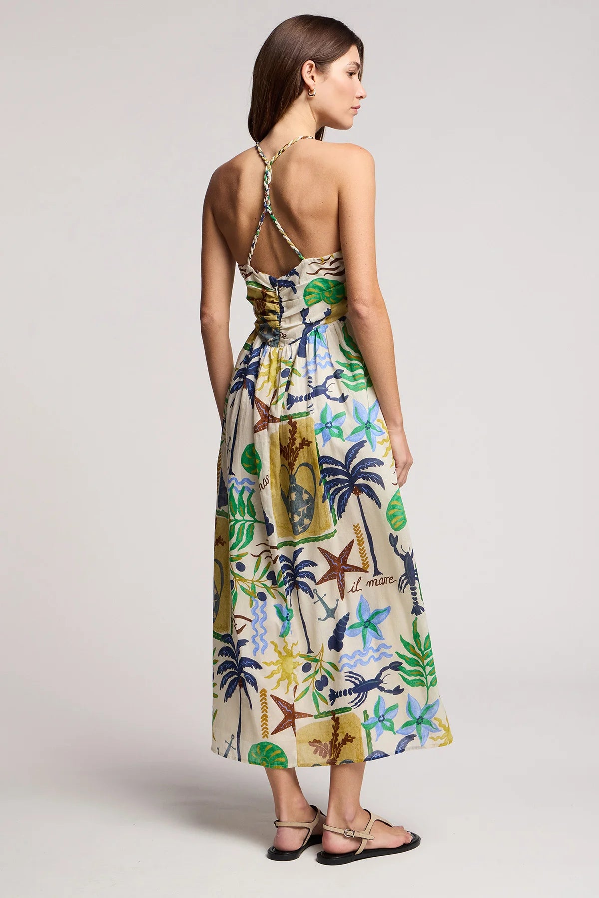 Woman wearing a floral dress with a white background