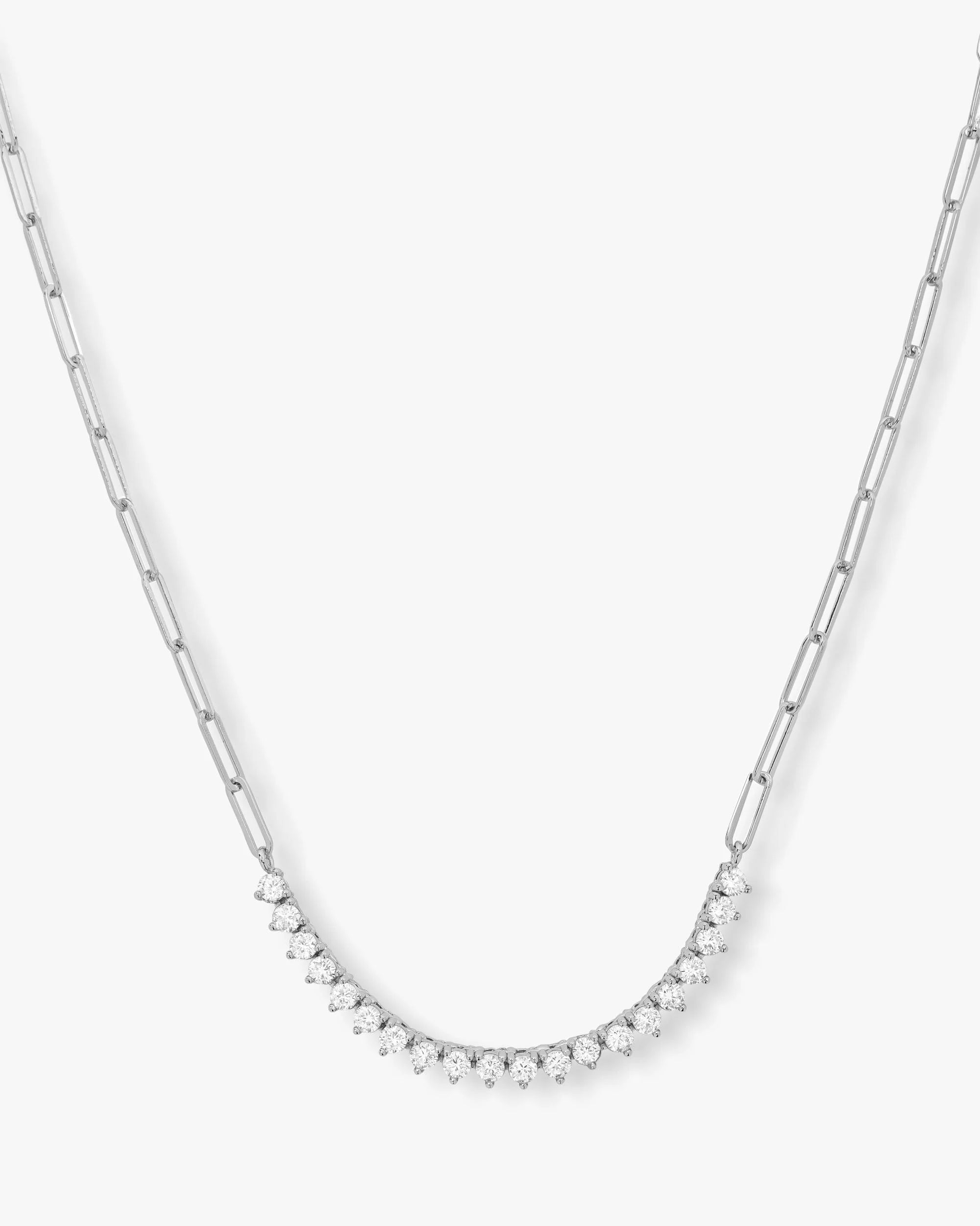 Silver chain necklace with small round beads on a white background