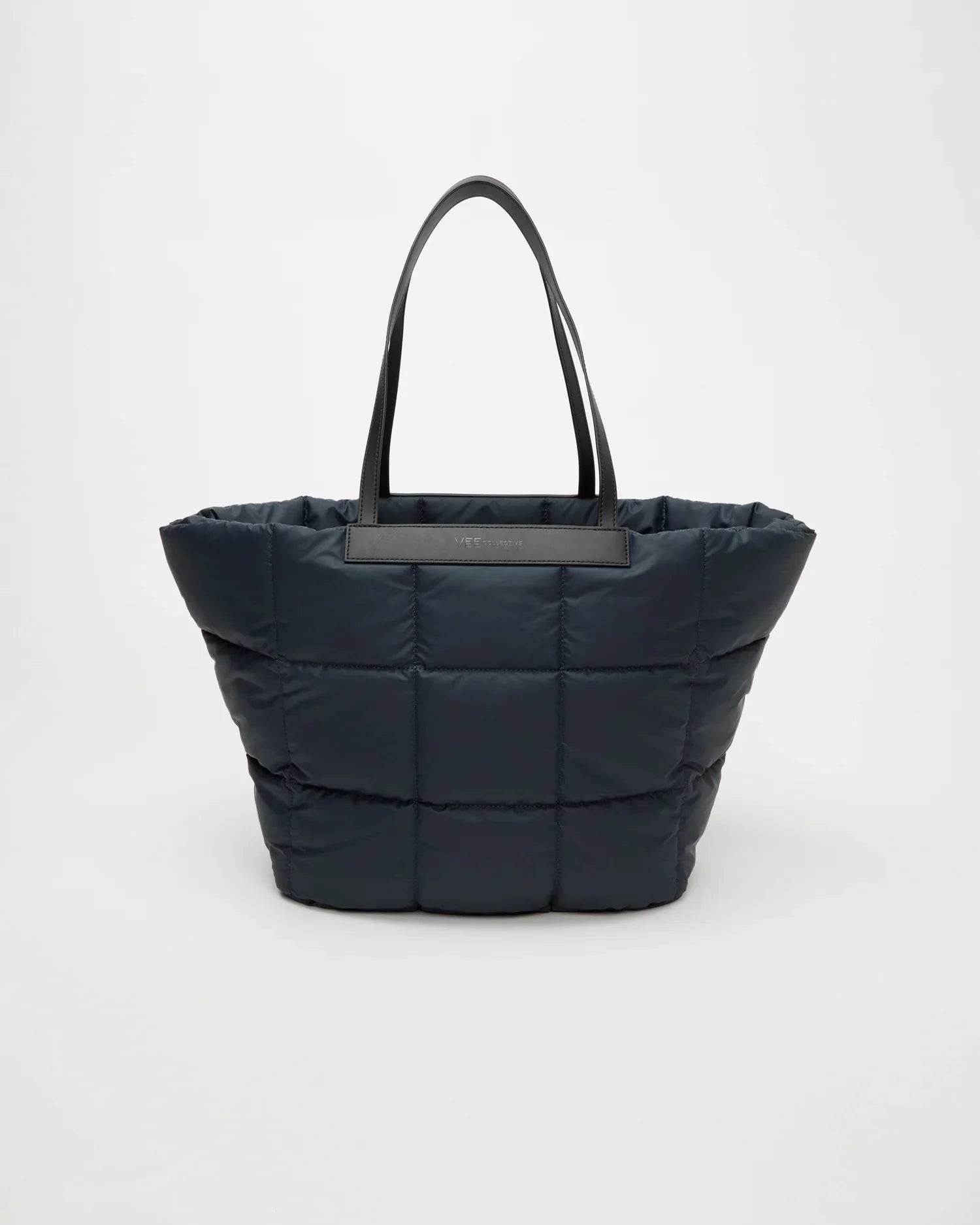 Black quilted tote bag on a white background