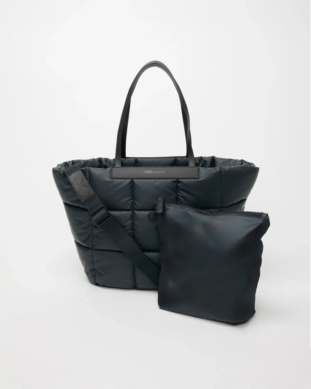 Black puffer bag with a shoulder strap on a white background