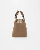 Brown tote bag with black straps on a white background