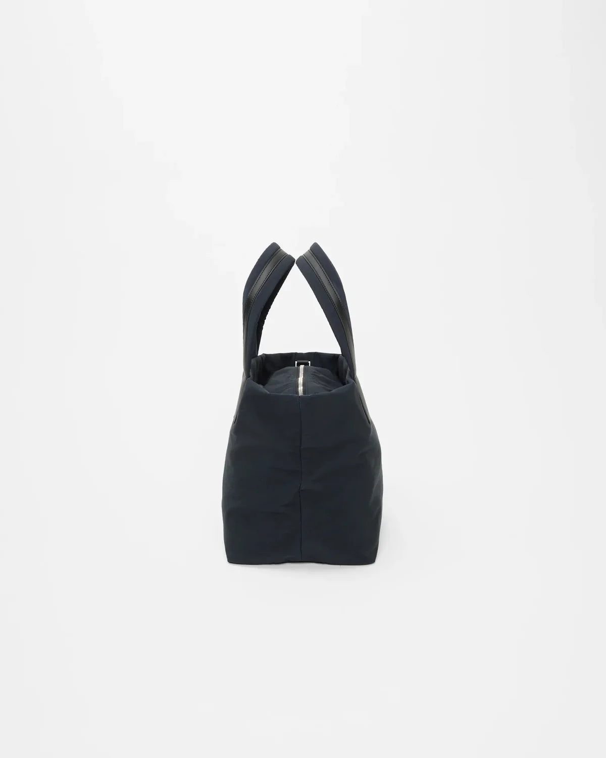 Black handbag with a unique design on a white background