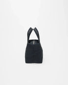 Black handbag with a unique design on a white background