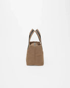 Brown tote bag with black straps on a white background
