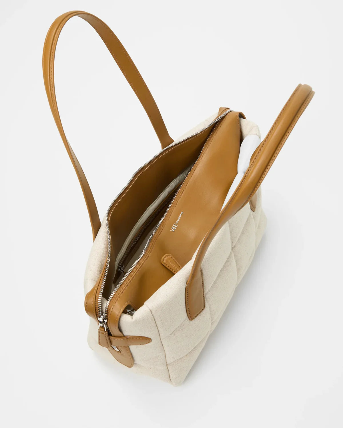 Beige handbag with brown accents on a light gray background