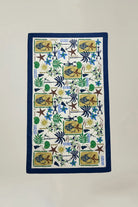 Decorative towel with colorful patterns on a plain background