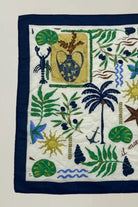 Decorative handkerchief with tropical patterns and symbols on a white background