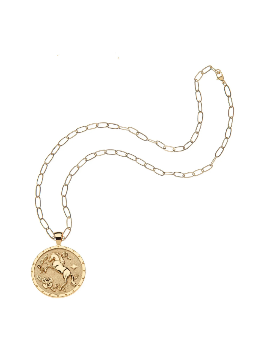 Gold necklace with a pendant on a white background