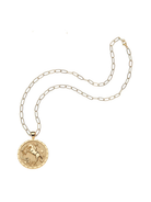Gold necklace with a pendant on a white background