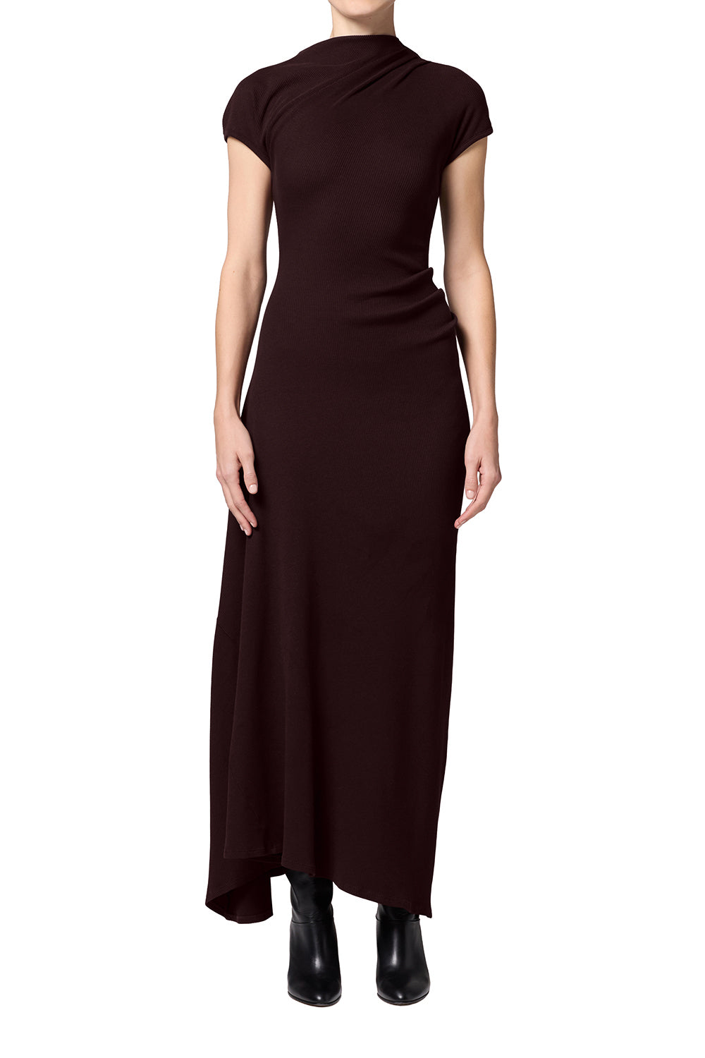 A dark brown, one-shoulder cap-sleeve maxi dress worn by a model, paired with black ankle boots, shot against a solid white background.