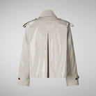 Beige trench coat on a white background