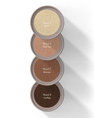 Four open makeup compact powders stacked vertically on a white background, showing shades labeled Nood 3, Nood 5, Nood 7, and Nood 9.