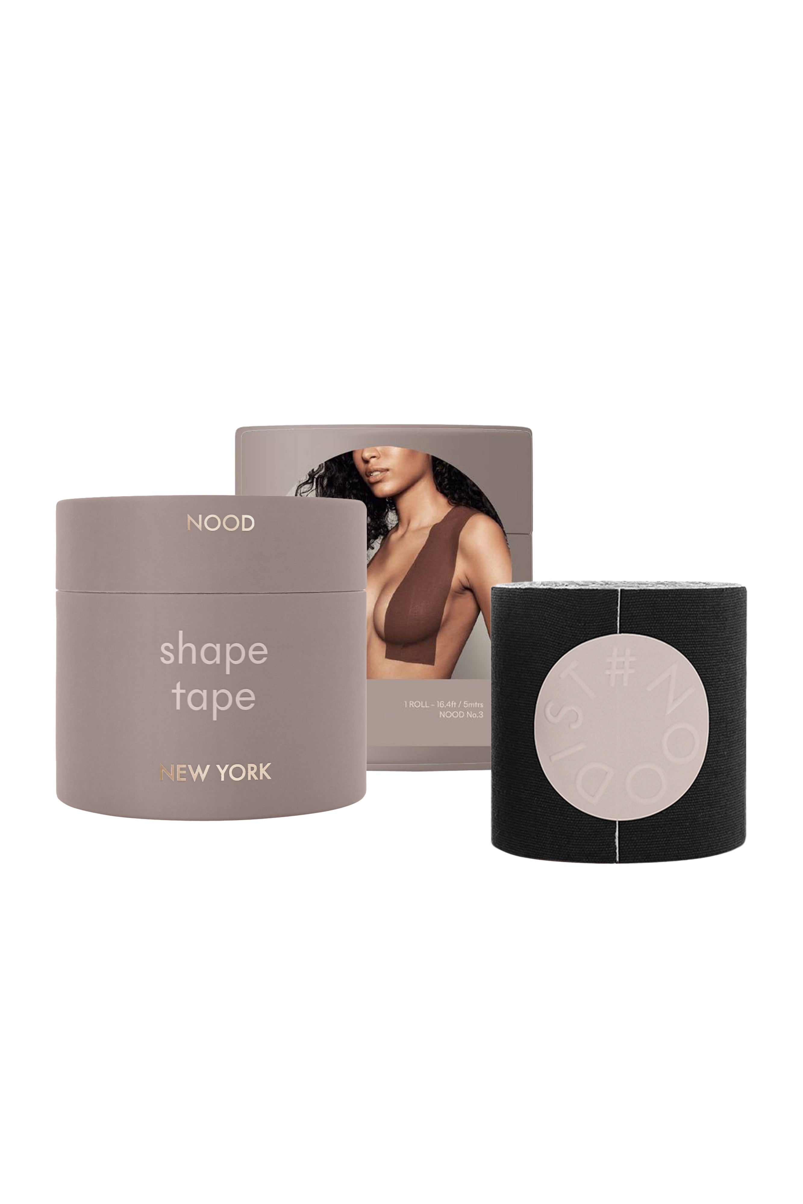 New York Nood Shape Tape hair product set featuring a taupe-gray jar labeled 'shape tape NEW YORK', a black outer sleeve with a circular cutout, and a backing card showing a model.
