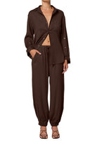 Brown outfit with jacket and pants on a white background