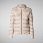 Beige puffer jacket on a light gray background