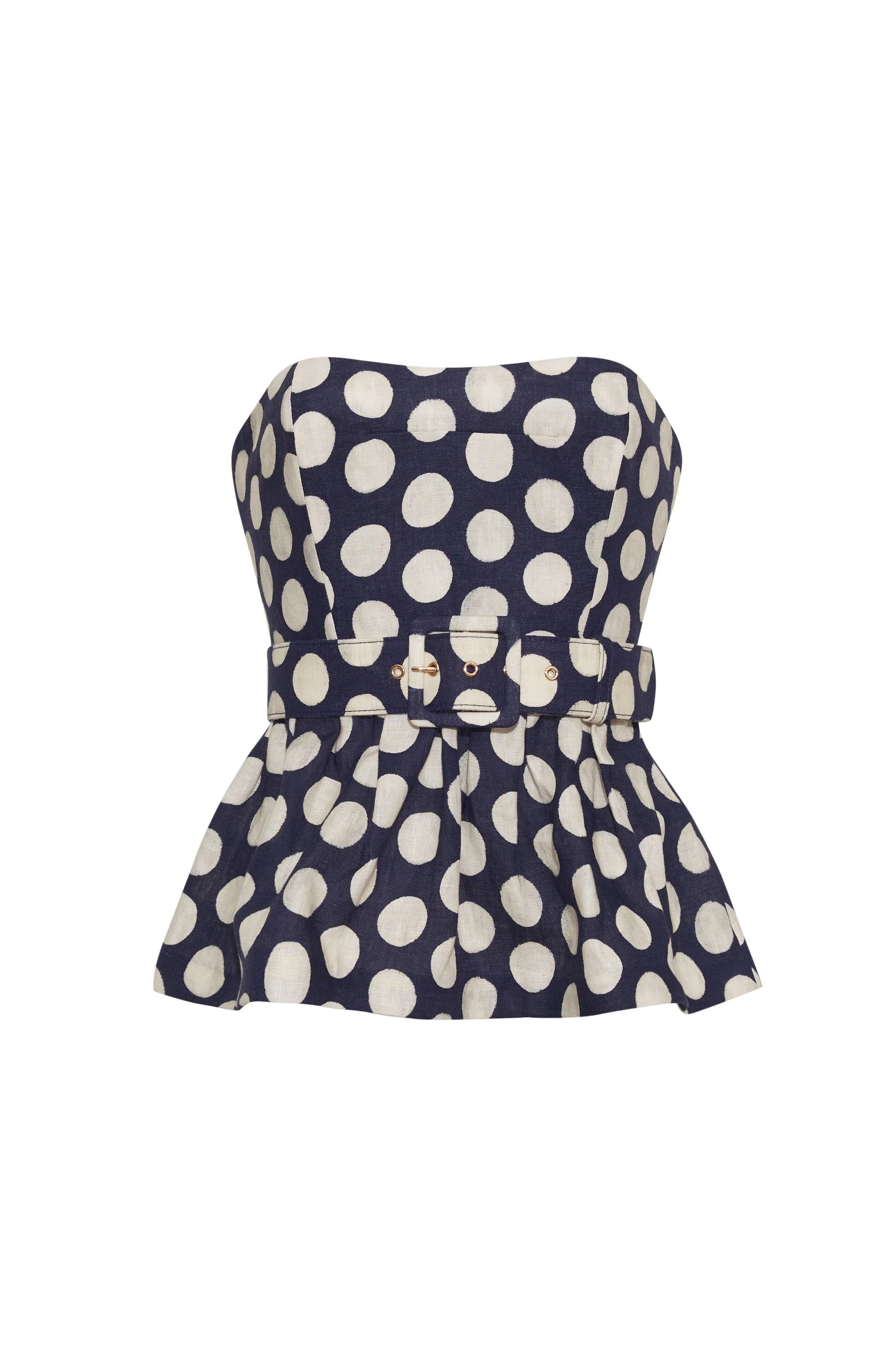 Navy strapless top with white polka dots on a white background